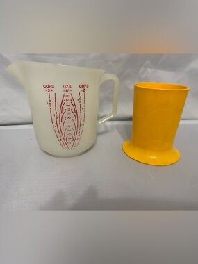 Tupperware White Measuring Pitcher with Red Markings and Yellow Flower cup